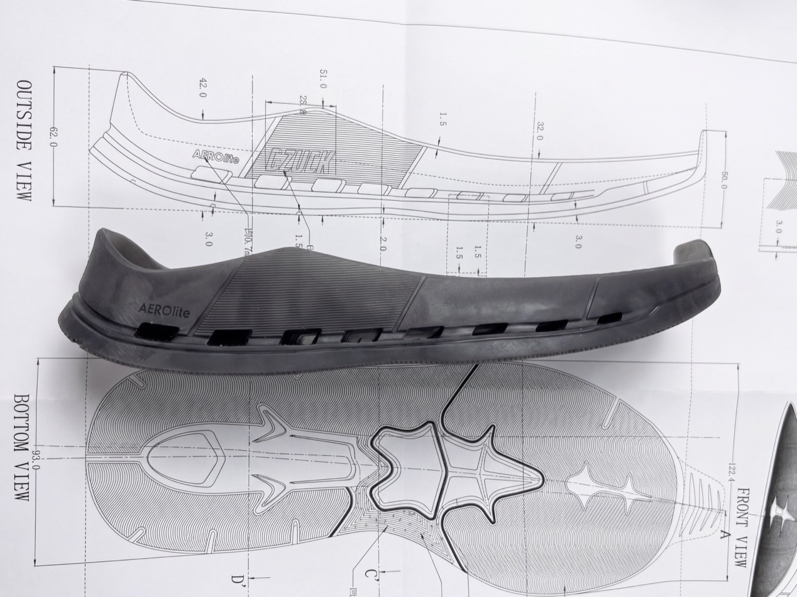 Outsole tooling sample over technical mold drawings